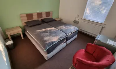 Ein Bett oder Betten in einem Zimmer der Unterkunft Hotel Linda