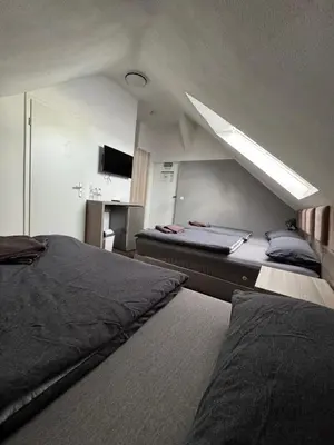 Ein Bett oder Betten in einem Zimmer der Unterkunft Hotel Linda