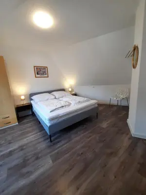 Ein Bett oder Betten in einem Zimmer der Unterkunft Ferienwohnung Langenberg Altstadt WiFi Netflix