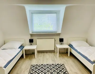 Ein Bett oder Betten in einem Zimmer der Unterkunft Monteur Appartement with six Beds and six Guests