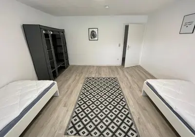 Ein Bett oder Betten in einem Zimmer der Unterkunft Monteur Appartement with six Beds and six Guests