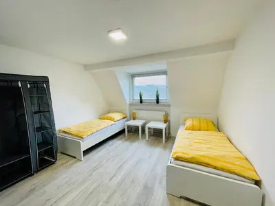 Ein Bett oder Betten in einem Zimmer der Unterkunft Monteur Appartement with six Beds and six Guests