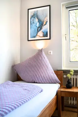 Ein Bett oder Betten in einem Zimmer der Unterkunft Hotel Garni Moers