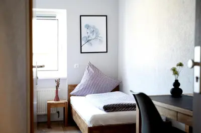 Ein Bett oder Betten in einem Zimmer der Unterkunft Hotel Garni Moers