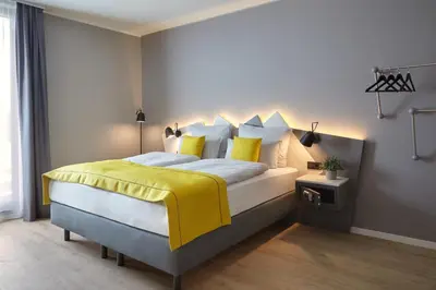 Ein Bett oder Betten in einem Zimmer der Unterkunft Candlewood Suites Düsseldorf Airport by IHG