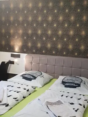 Ein Bett oder Betten in einem Zimmer der Unterkunft Waldhotel Lemberg