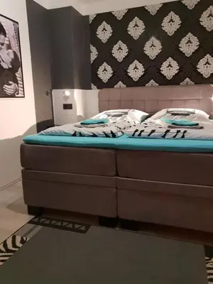 Ein Bett oder Betten in einem Zimmer der Unterkunft Waldhotel Lemberg