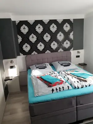 Ein Bett oder Betten in einem Zimmer der Unterkunft Waldhotel Lemberg