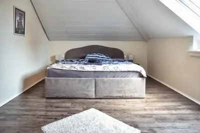 Ein Bett oder Betten in einem Zimmer der Unterkunft Ferienwohnung BEST