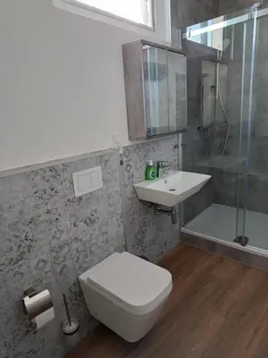 Ein Badezimmer in der Unterkunft HeimatHerz Hotel Garni