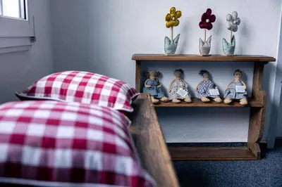 Ein Bett oder Betten in einem Zimmer der Unterkunft HeimatHerz Hotel Garni