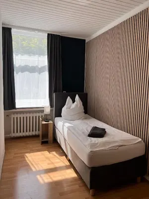 Ein Bett oder Betten in einem Zimmer der Unterkunft Hotel Monopol