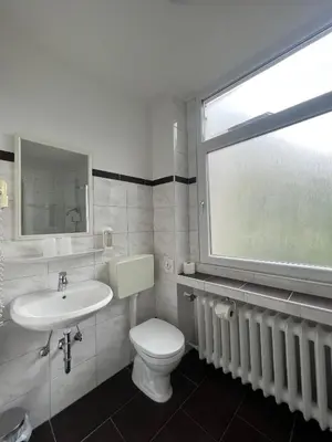 Ein Badezimmer in der Unterkunft Hotel Monopol