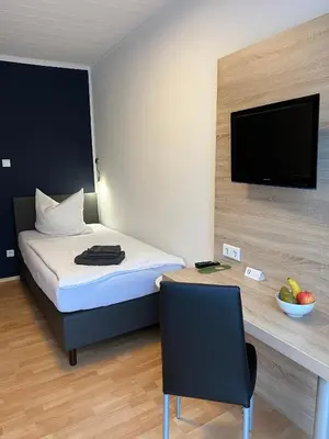 Ein Bett oder Betten in einem Zimmer der Unterkunft Hotel Monopol