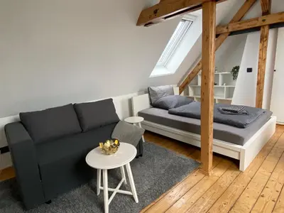 Ein Sitzbereich in der Unterkunft Messeapartment Stockum