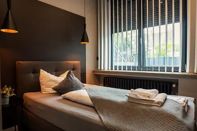 Ein Bett oder Betten in einem Zimmer der Unterkunft Liro Hotel Moers