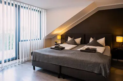 Ein Bett oder Betten in einem Zimmer der Unterkunft Liro Hotel Moers