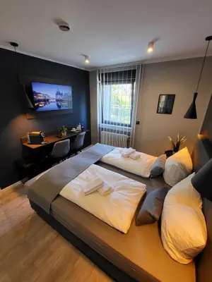 Ein Bett oder Betten in einem Zimmer der Unterkunft Liro Hotel Moers
