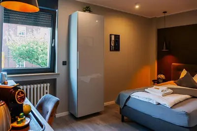 Ein Bett oder Betten in einem Zimmer der Unterkunft Liro Hotel Moers