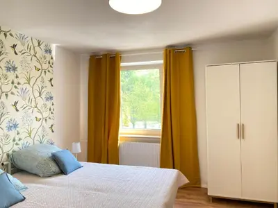 Ein Bett oder Betten in einem Zimmer der Unterkunft SOMMER GARTEN neben Hbf Duisburg