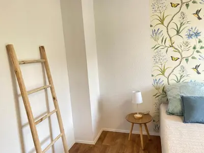Ein Bett oder Betten in einem Zimmer der Unterkunft SOMMER GARTEN neben Hbf Duisburg