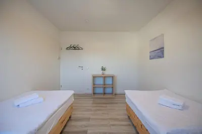 Ein Bett oder Betten in einem Zimmer der Unterkunft T&K Apartments - 3 Room Apartment with Balcony