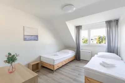Ein Bett oder Betten in einem Zimmer der Unterkunft T&K Apartments - 3 Room Apartment with Balcony