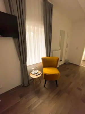 Ein Sitzbereich in der Unterkunft Hotel Kronenkurve