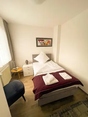Ein Bett oder Betten in einem Zimmer der Unterkunft Hotel Kronenkurve