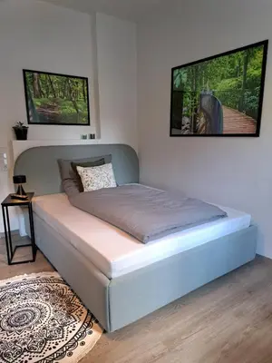 Ein Bett oder Betten in einem Zimmer der Unterkunft Waldstadt-Apartments