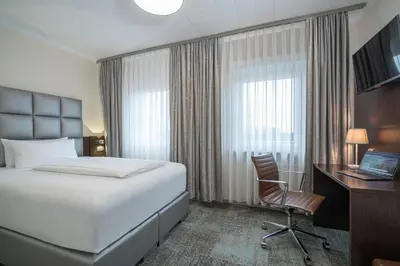 Ein Bett oder Betten in einem Zimmer der Unterkunft Hotel Königshof Dortmund