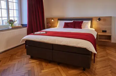 Ein Bett oder Betten in einem Zimmer der Unterkunft Erler Koornhuus # Herberge # Bett & Bike