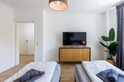 Ein Bett oder Betten in einem Zimmer der Unterkunft Glück Auf Appartements Schleiermacherstraße Duisburg
