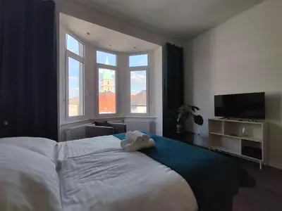 Ein Bett oder Betten in einem Zimmer der Unterkunft Diamera Appartments Zentral und Modern