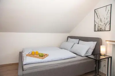 Ein Bett oder Betten in einem Zimmer der Unterkunft Neue Ferienwohnung in Marl