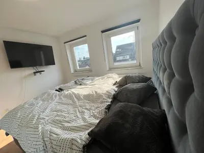 Ein Bett oder Betten in einem Zimmer der Unterkunft Suite 110qm nahe Rhein