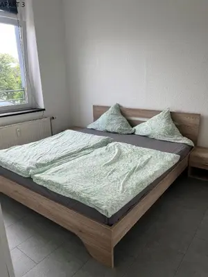 Ein Bett oder Betten in einem Zimmer der Unterkunft Apartment in Solingen Ohligs