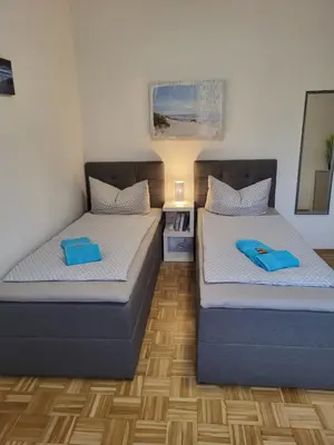Ein Bett oder Betten in einem Zimmer der Unterkunft Näher Messe und Flughafen