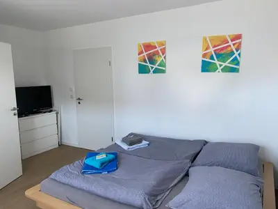 Ein Bett oder Betten in einem Zimmer der Unterkunft Messezimmer nahe der Düsseldorfer Messe mit eigenem Eingang und gratis Minibar