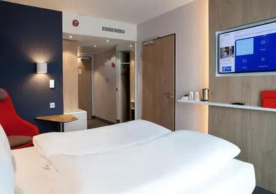 Ein Bett oder Betten in einem Zimmer der Unterkunft Holiday Inn Express - Düsseldorf Airport