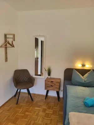 Ein Bett oder Betten in einem Zimmer der Unterkunft Messe Flughafen