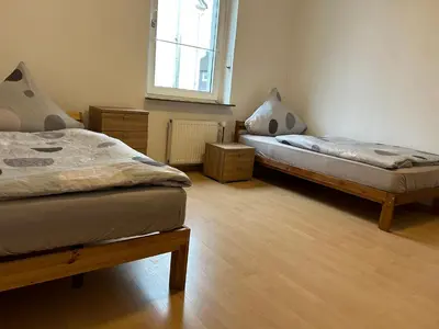 Ein Bett oder Betten in einem Zimmer der Unterkunft Monteur Residenz