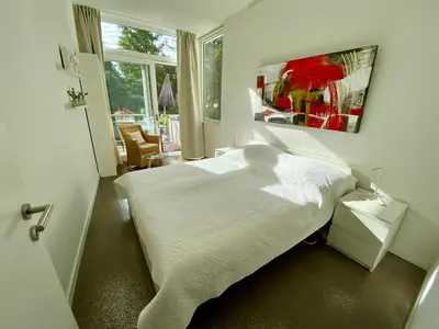 Ein Bett oder Betten in einem Zimmer der Unterkunft Atelier-Ferienwohnung