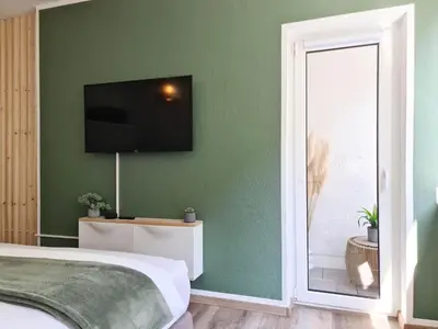 TV/Unterhaltungsangebot in der Unterkunft Schöne Ferienwohnung im Zentrum mit Self Check-In und Free Wifi