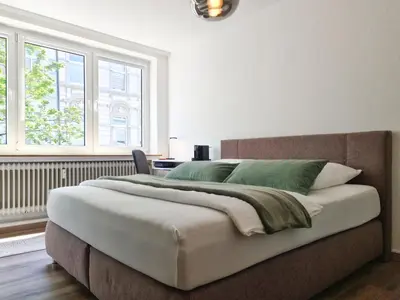 Ein Bett oder Betten in einem Zimmer der Unterkunft Schöne Ferienwohnung im Zentrum mit Self Check-In und Free Wifi
