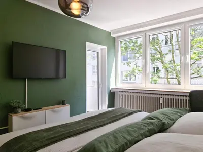 Ein Bett oder Betten in einem Zimmer der Unterkunft Schöne Ferienwohnung im Zentrum mit Self Check-In und Free Wifi