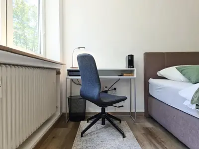 Ein Bett oder Betten in einem Zimmer der Unterkunft Schöne Ferienwohnung im Zentrum mit Self Check-In und Free Wifi