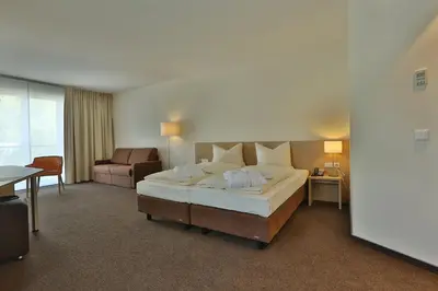 Ein Bett oder Betten in einem Zimmer der Unterkunft Ardey Hotel