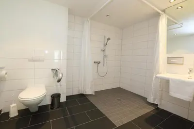 Ein Badezimmer in der Unterkunft Ardey Hotel