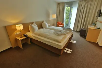 Ein Bett oder Betten in einem Zimmer der Unterkunft Ardey Hotel